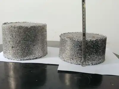 Aluminium granule briquettes shown with a height measurement