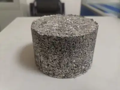 Compact cylindrical block made from aluminium granules