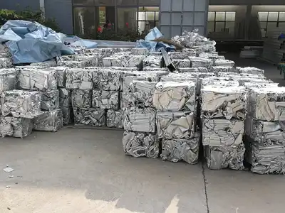 Baled aluminium profiles stored in a recycling yard
