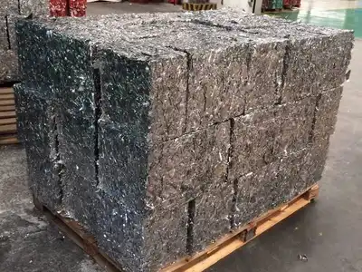 Large aluminium scrap bales stacked on a pallet