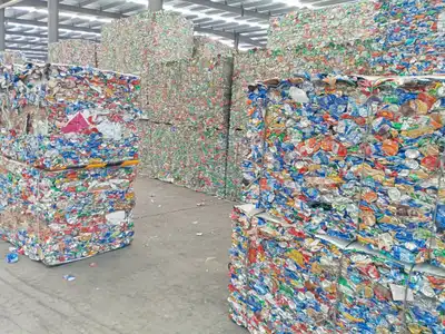 Sorted aluminium beverage can bales in a recycling plant