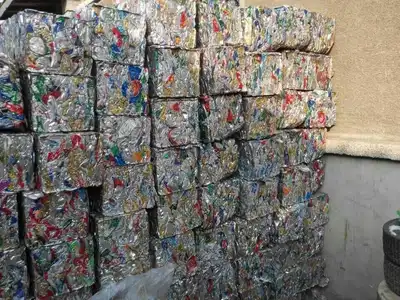 Stacked aluminium used beverage can bales