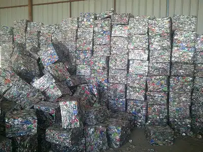 Aluminium can bales stored in a recycling warehouse