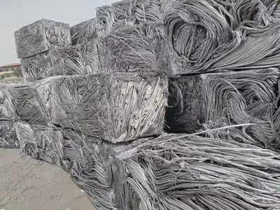 Dense rectangular bales made from tangled aluminium wire
