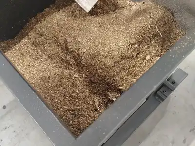Brass machining chips in a feed hopper