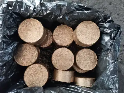Finished brass briquettes collected in a lined container