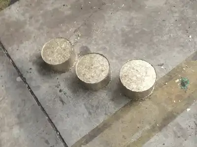 Three compressed brass turnings briquettes