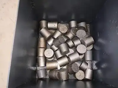 Finished cast iron chip briquettes in a collection box