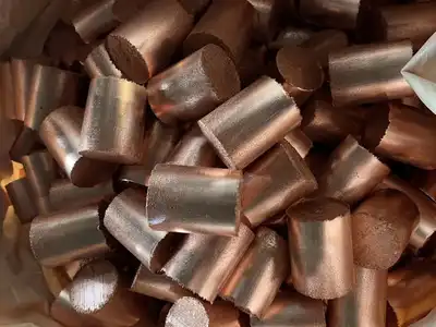 Small dense briquettes produced from copper granules