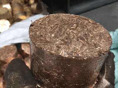 Close-up of a compressed copper shavings briquette