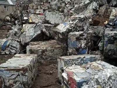 Light-gauge sheet metal bales stored in a recycling yard