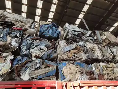 Mixed light steel scrap compressed into transport bales