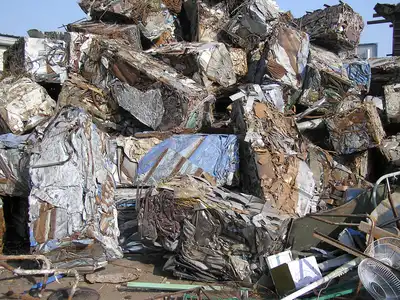 Mixed light ferrous scrap bales at a recycling yard