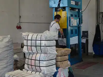 Vertical lifting-box baler used for old clothes
