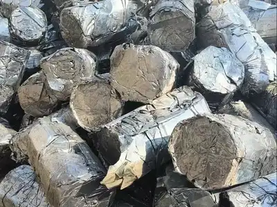 Round-end compact bales made from stainless steel sheet scrap