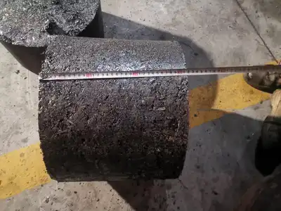 Large steel chip briquette being measured