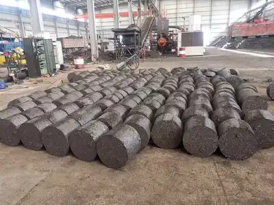 Rows of steel chip briquettes produced in an industrial workshop