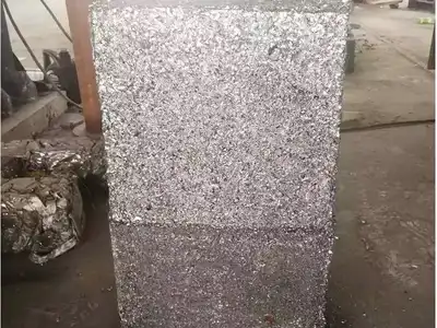 Large rectangular bale made from compressed steel shavings