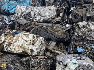 Mixed end-of-life vehicle bales in a recycling yard