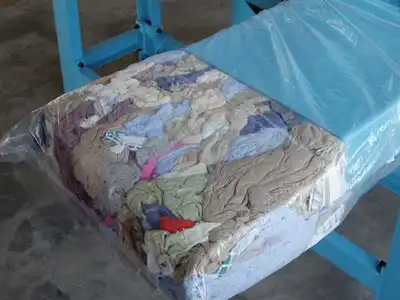 Compressed wiping-rag block ready for manual bagging