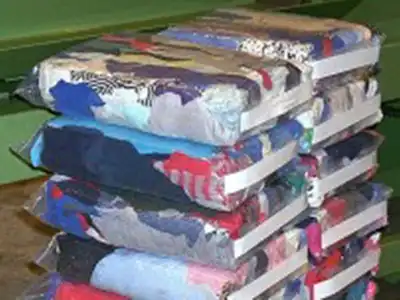 Compressed wiping-rag blocks secured with straps