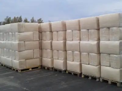 Rows of bagged sawdust bales on pallets