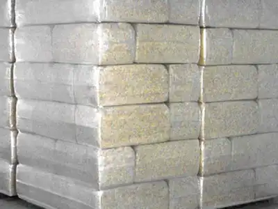 Uniform stacked packages of compressed sawdust