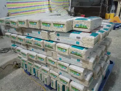 Compressed wood-shavings bales stacked on a pallet