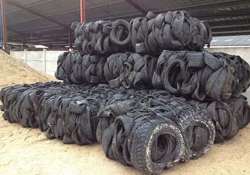 Several retained waste-tire bales grouped in a covered area