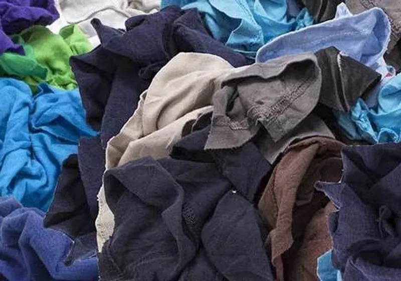 Sorted coloured cotton rags and textile pieces before compression