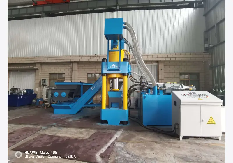 Vertical briquetting press with upper feed hopper and hydraulic power unit
