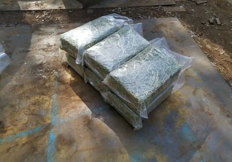 Three rectangular alfalfa hay packages viewed from another angle