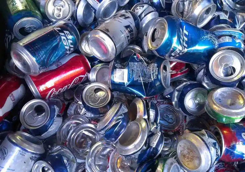 Loose aluminium used beverage cans before hydraulic baling