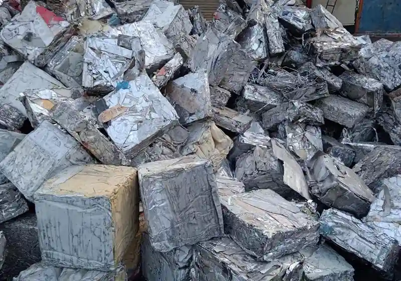 Compressed light-gauge sheet-steel scrap formed into block-shaped bales