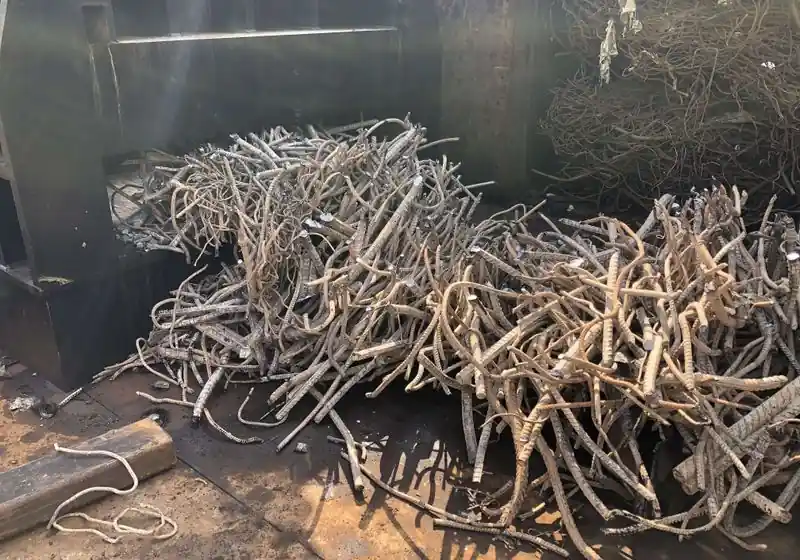 Shortened reinforcing bars collected at a container shear outlet