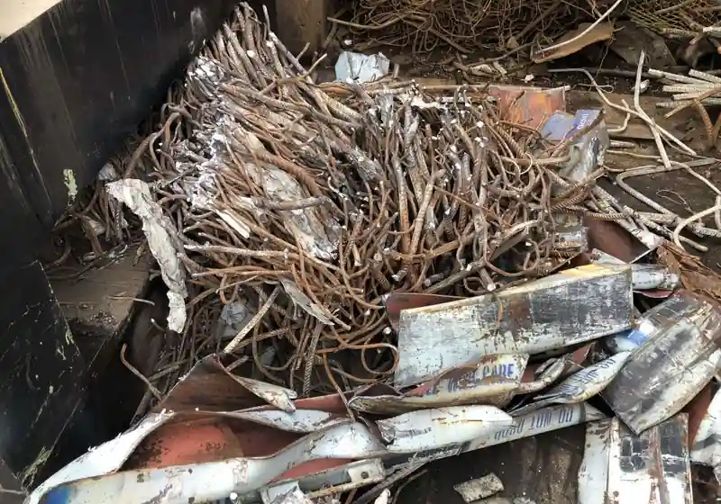 Sheared reinforcing bars mixed with cut structural steel sections