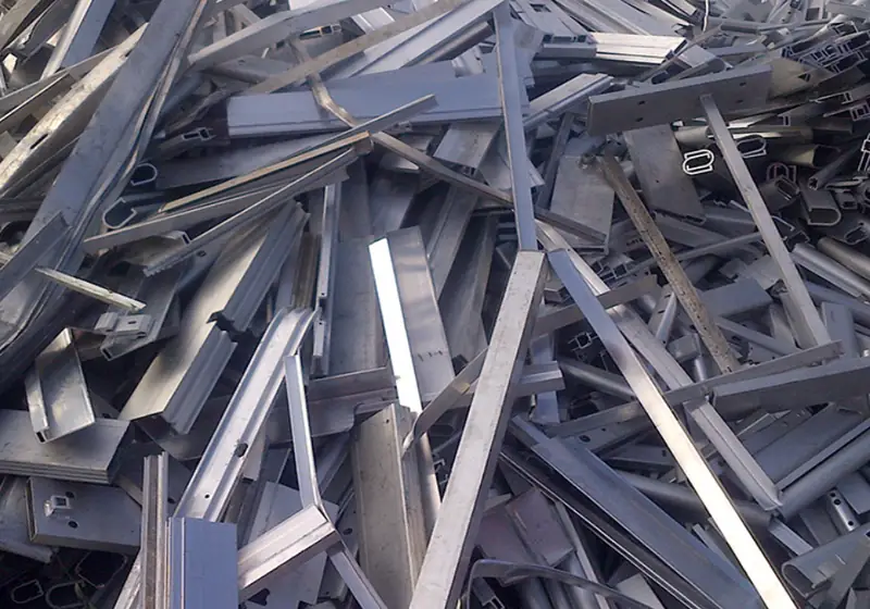 Loose aluminium extrusion profile offcuts before baling