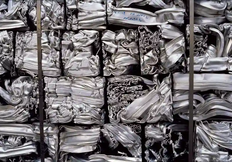 Strapped compressed aluminium extrusion profile bales in close-up